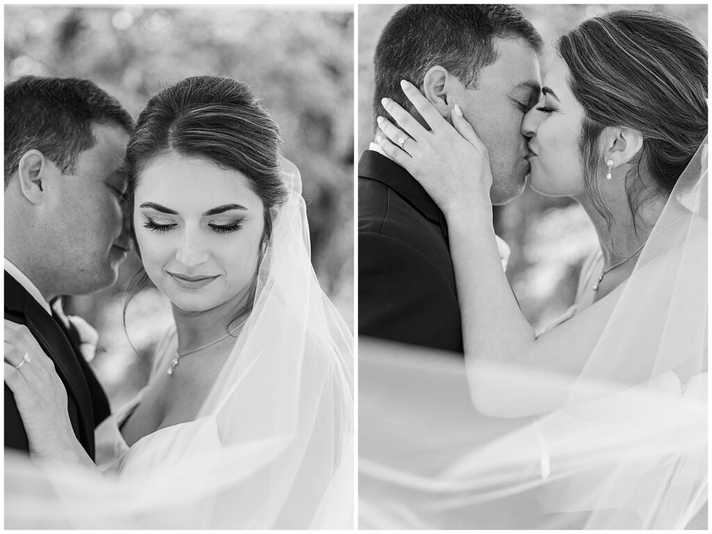 Bride and groom smiling and standing together in front of rustic barn doors at Shiloh Farm wedding in Tallahassee