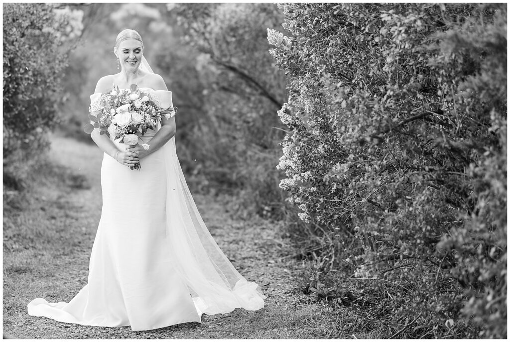 Newlyweds walking barefoot along the shore after their intimate Florida wedding ceremony