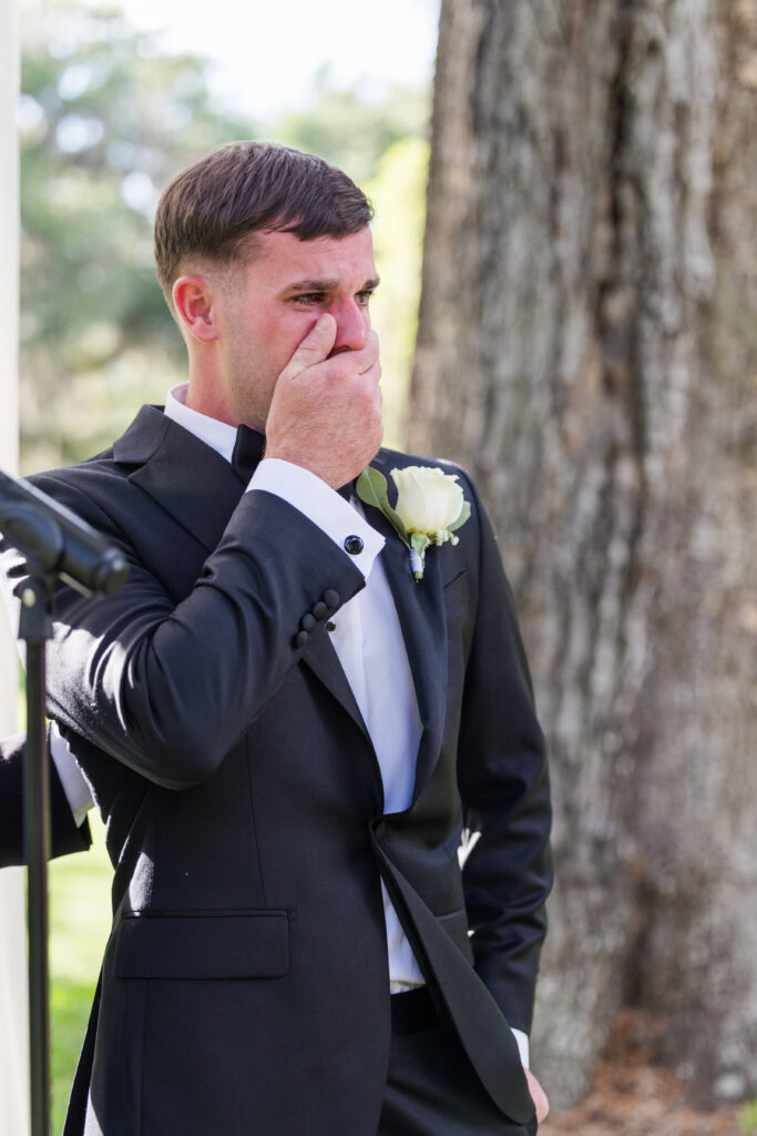 Groom crying during first look