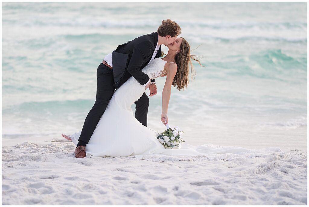 Bride’s dress flowing in the coastal wind during portraits.