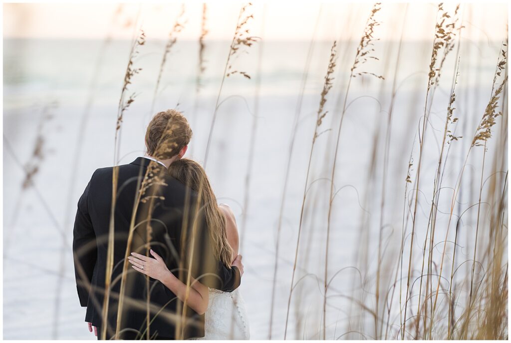 Bride and groom watching the sunset