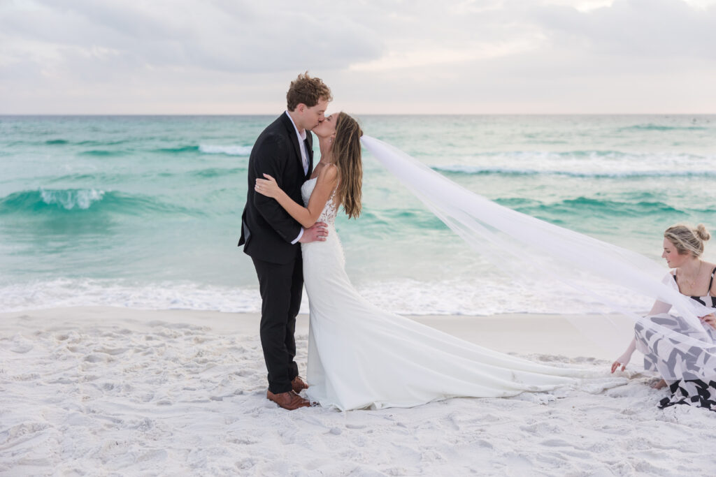 Wedding Planner helping with veil 